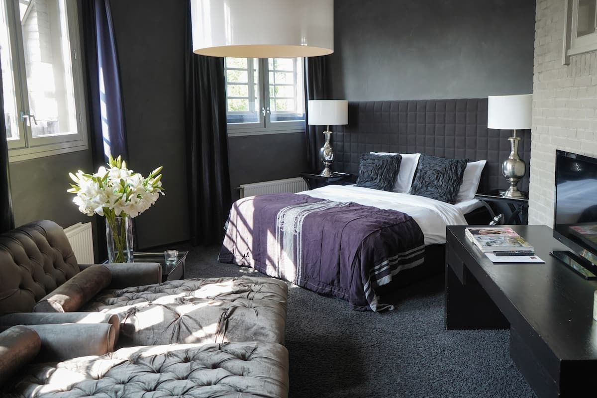 Suite (Celblok) | Minibar, lydisolert, strykejern/-brett og barnesenger