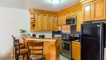 Deluxe Duplex, 2 Bedrooms | Private kitchen | Full-sized fridge, microwave, oven, stovetop