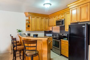 Deluxe Duplex, 2 Bedrooms | Private kitchen | Full-size fridge, microwave, oven, stovetop