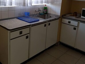 Apartment, 1 Bedroom | Private kitchen | Fridge, coffee/tea maker