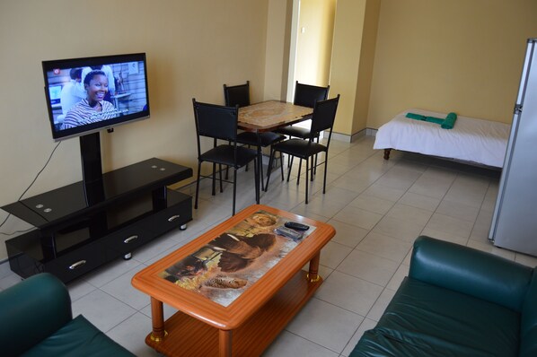 Apartment, 1 Bedroom | Living area | TV - Phumula Apartments (Victoria Falls)