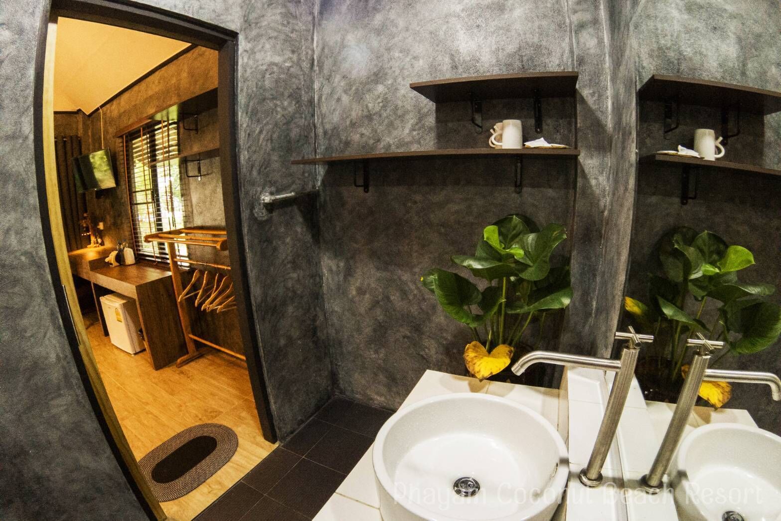 A modern bathroom with two sinks, a mirror, and shelves above the sinks.