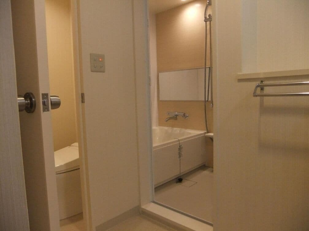 A bathroom with a bathtub, a shower, and a toilet.