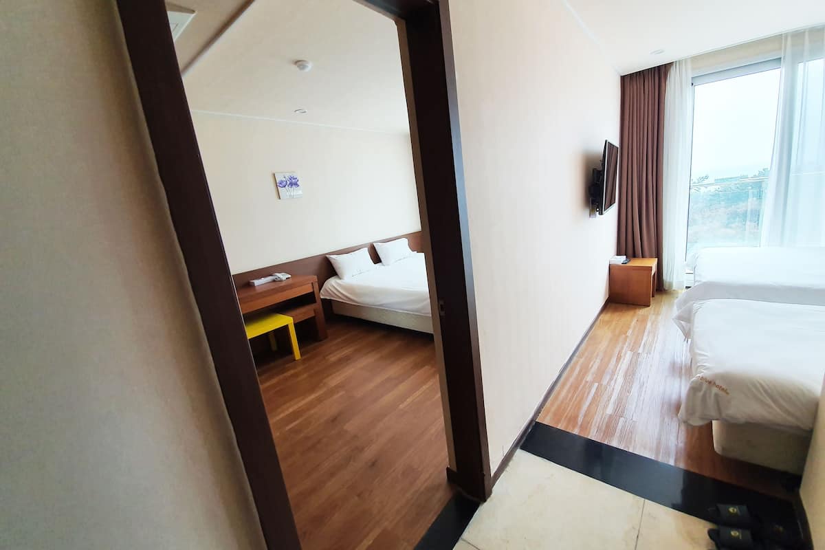 Family Room, Ocean View | Blackout curtains, soundproofing, free WiFi, bed sheets