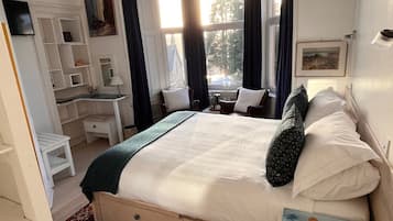 Individually decorated, desk, blackout drapes, iron/ironing board