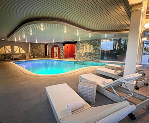Indoor pool, seasonal outdoor pool, pool umbrellas, pool loungers