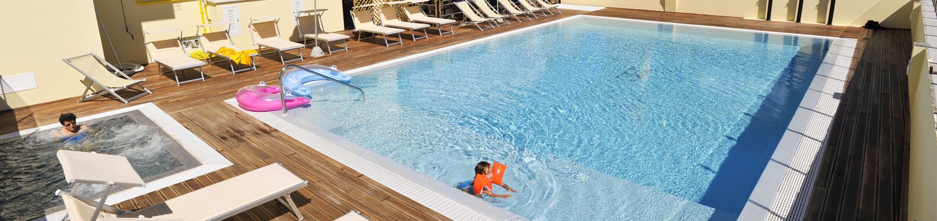 seasonal outdoor pool, open 9 am to 7 pm, pool loungers