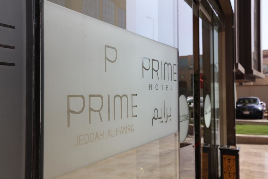 A sign for the Prime Hotel in Jedda, Al Hamra, with a clear view of the hotel's name and location.