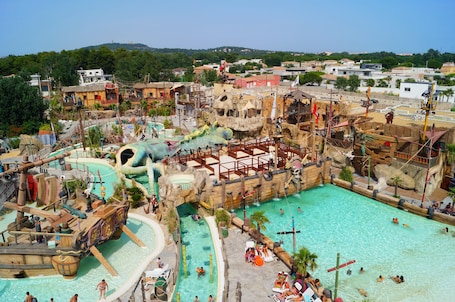 Seasonal outdoor pool, pool loungers. Hotel Pirates World