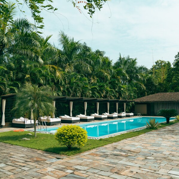 Outdoor pool, open 8 AM to 8:00 PM, pool loungers - Kasara Resort - Chitwan National Park (Bharatpur)