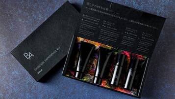 A skincare product box with four items and a booklet.