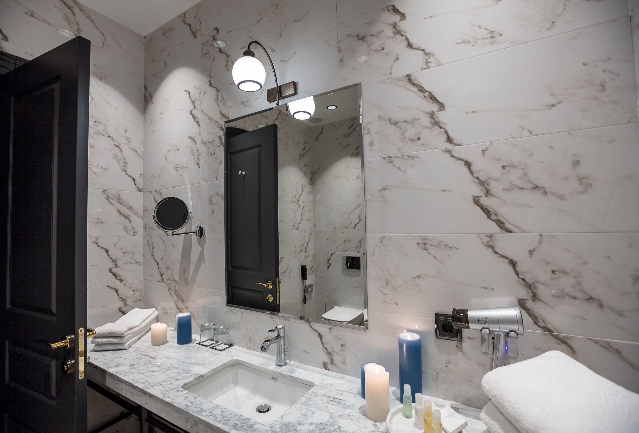 designer toiletries, hair dryer, bathrobes, slippers