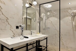 Designer toiletries, hair dryer, bathrobes, slippers