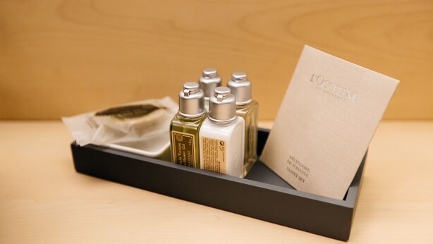 A black box containing several bottles of perfume and a card with the text "EOCCTANE IN PROVENCE". - Hallstatt Hideaway - Adults only (Hallstatt)