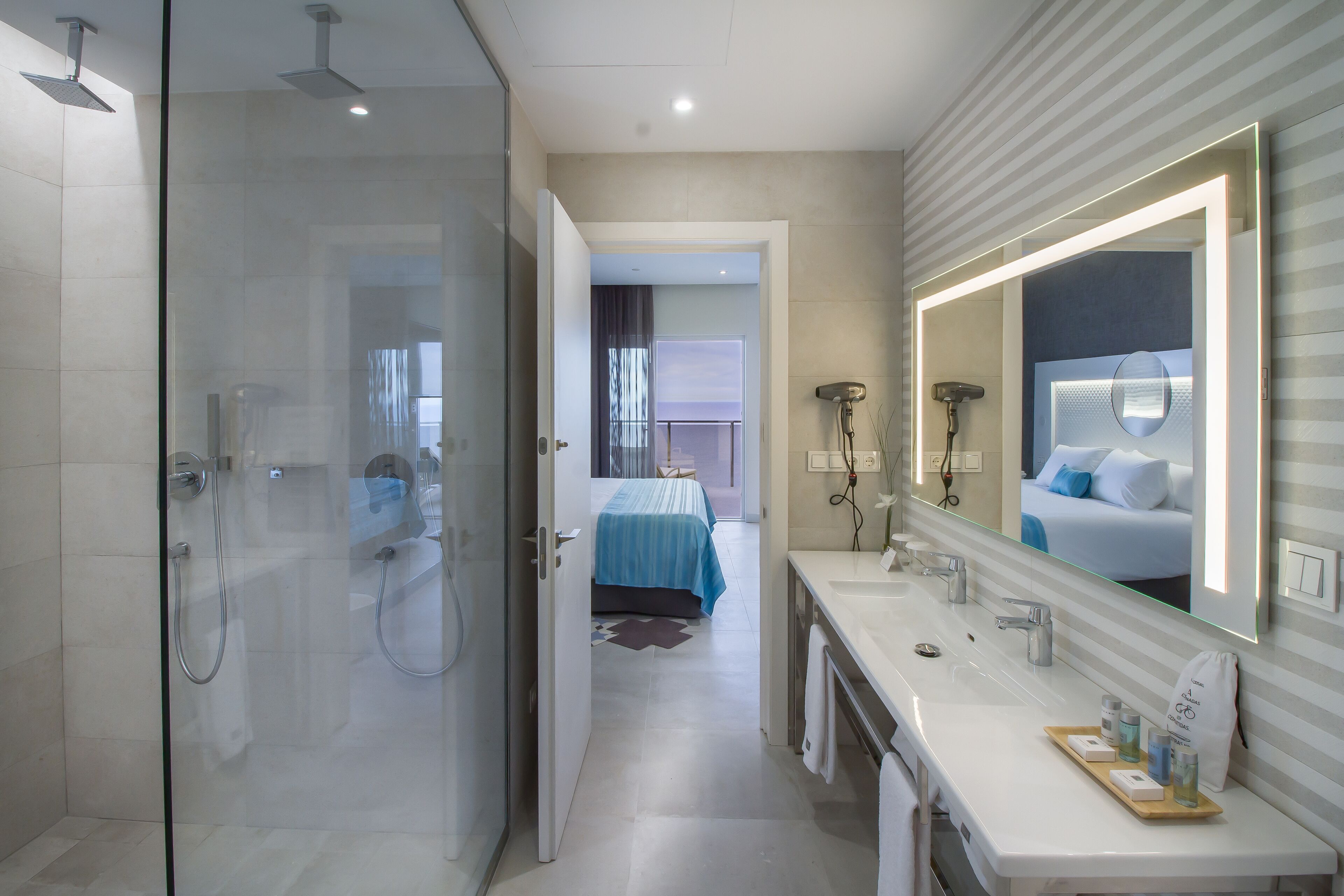 designer toiletries, hair dryer, towels