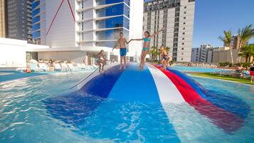4 outdoor pools, open 9:00 AM to 8:00 PM, pool umbrellas, pool loungers