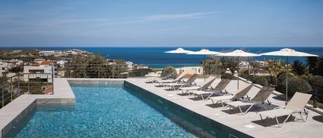 Seasonal outdoor pool, pool umbrellas, pool loungers