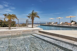 Seasonal outdoor pool, pool umbrellas, pool loungers