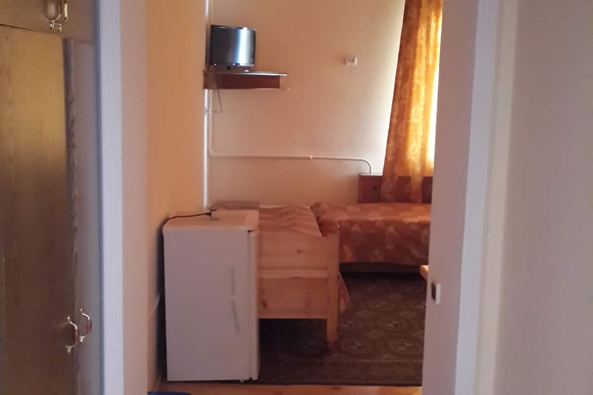 deluxe quadruple room | living area | tv