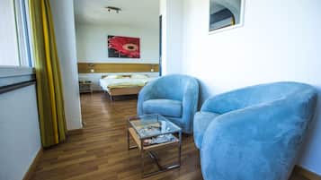 Junior Suite | Living area | Flat-screen TV