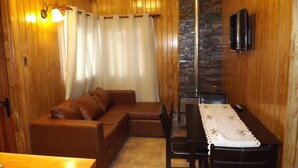 Standard Cabin, 2 Bedrooms, Private Bathroom, Courtyard View | Living room | 42-inch LED TV with cable channels, TV - Cabañas Pulegan (Porvenir)