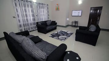 Apartment, 2 Bedrooms, Accessible, Smoking | Living room | Flat-screen TV