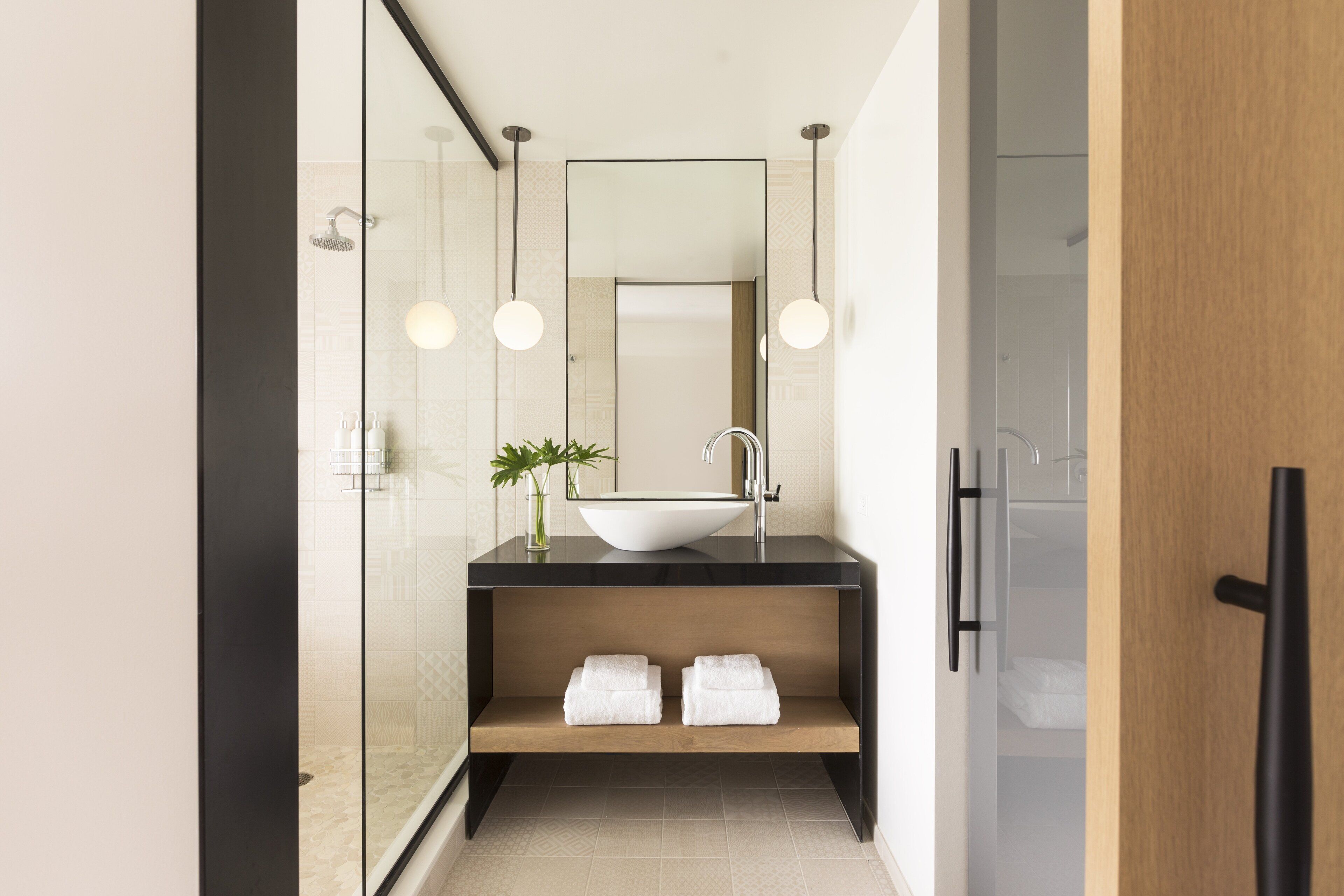 Designer toiletries, hair dryer, bathrobes, slippers