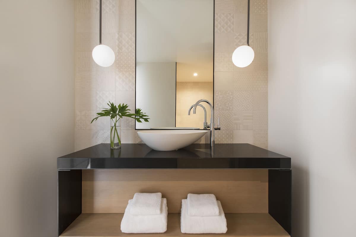 designer toiletries, hair dryer, bathrobes, slippers