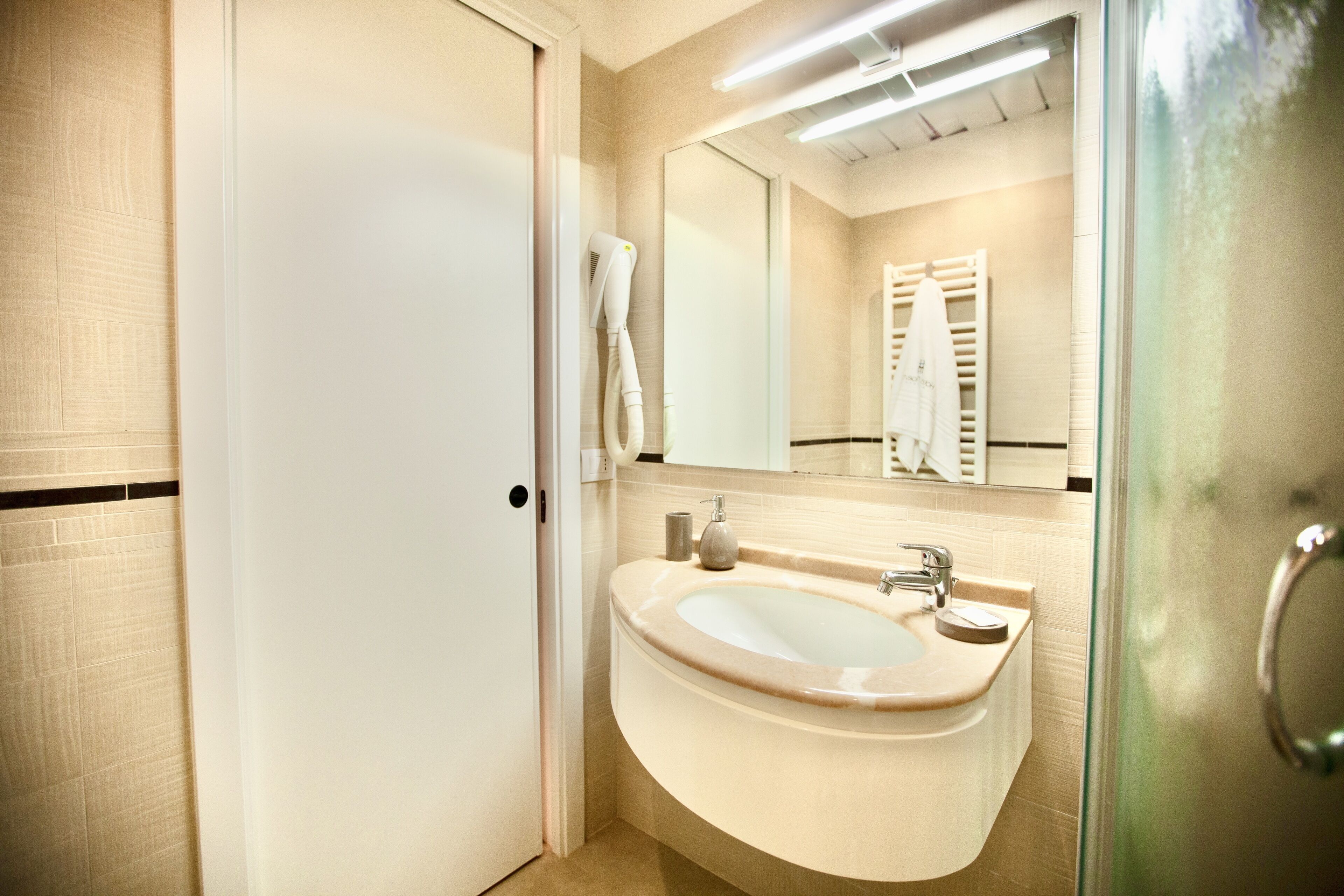 shower, hair dryer, bidet, towels