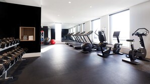 A modern gym with treadmills, stationary bikes, and dumbbells. - Hyatt Place Melbourne, Essendon Fields (Essendon Fields)