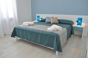 Panoramic Triple Room, Hill View | Minibar, in-room safe, desk, soundproofing