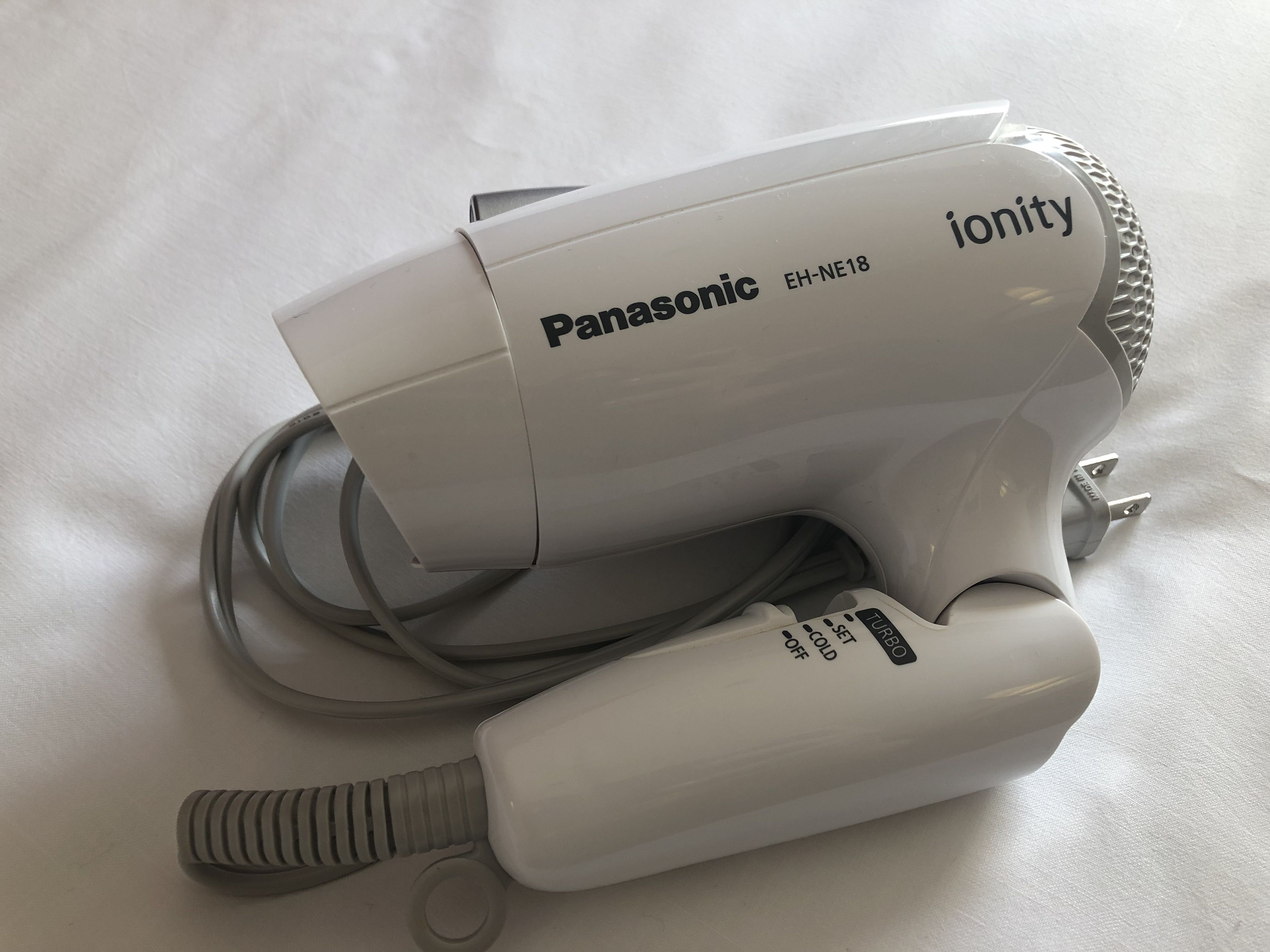 combined shower/bathtub, free toiletries, hair dryer, slippers