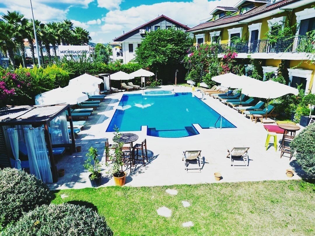 seasonal outdoor pool, pool umbrellas, pool loungers