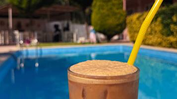 Outdoor pool, pool umbrellas, sun loungers