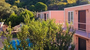 A villa with a pool, surrounded by lush greenery and hills. - Ali Baba Butik Otel (Marmara)