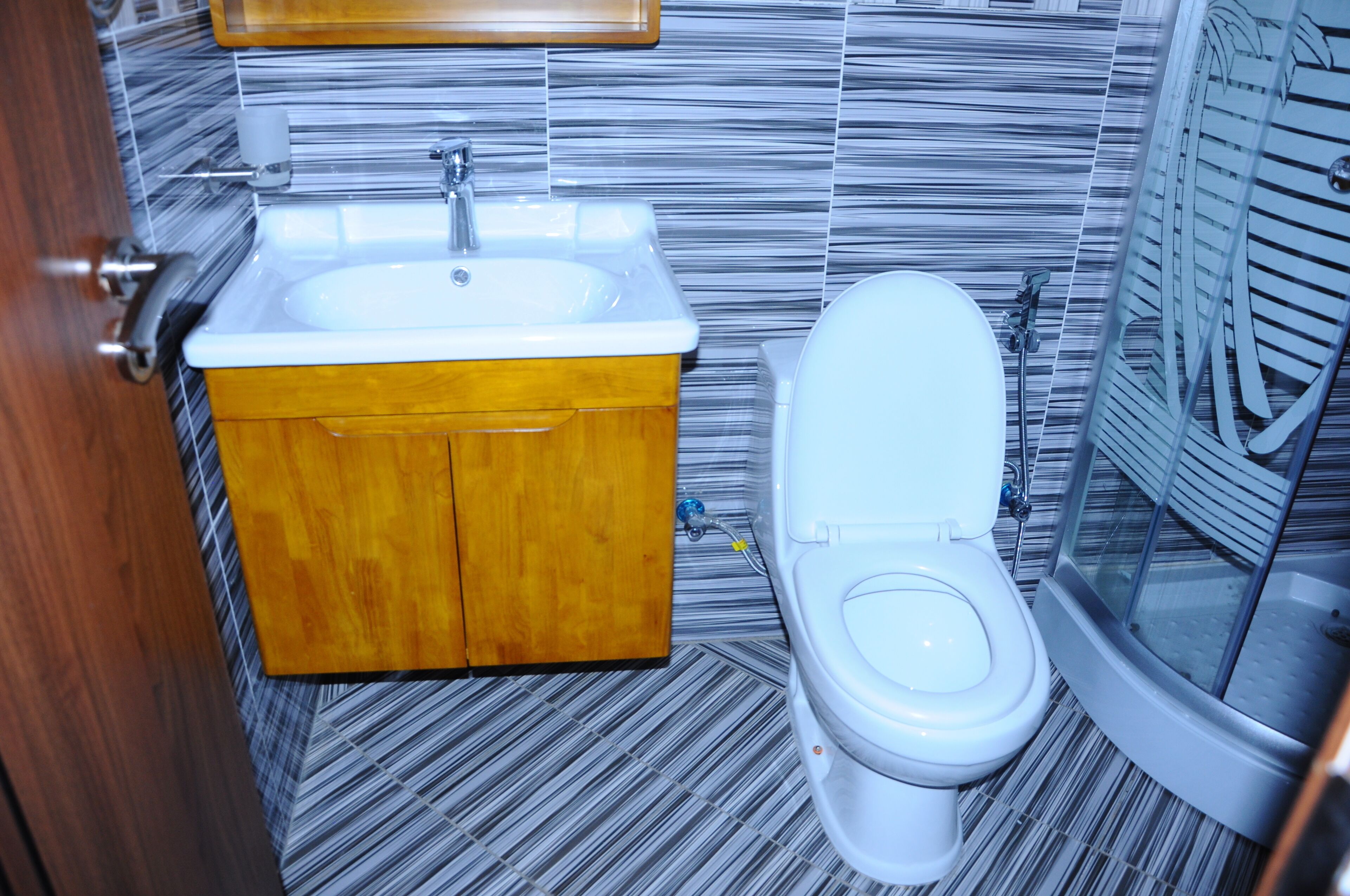 shower, hair dryer, bathrobes, slippers