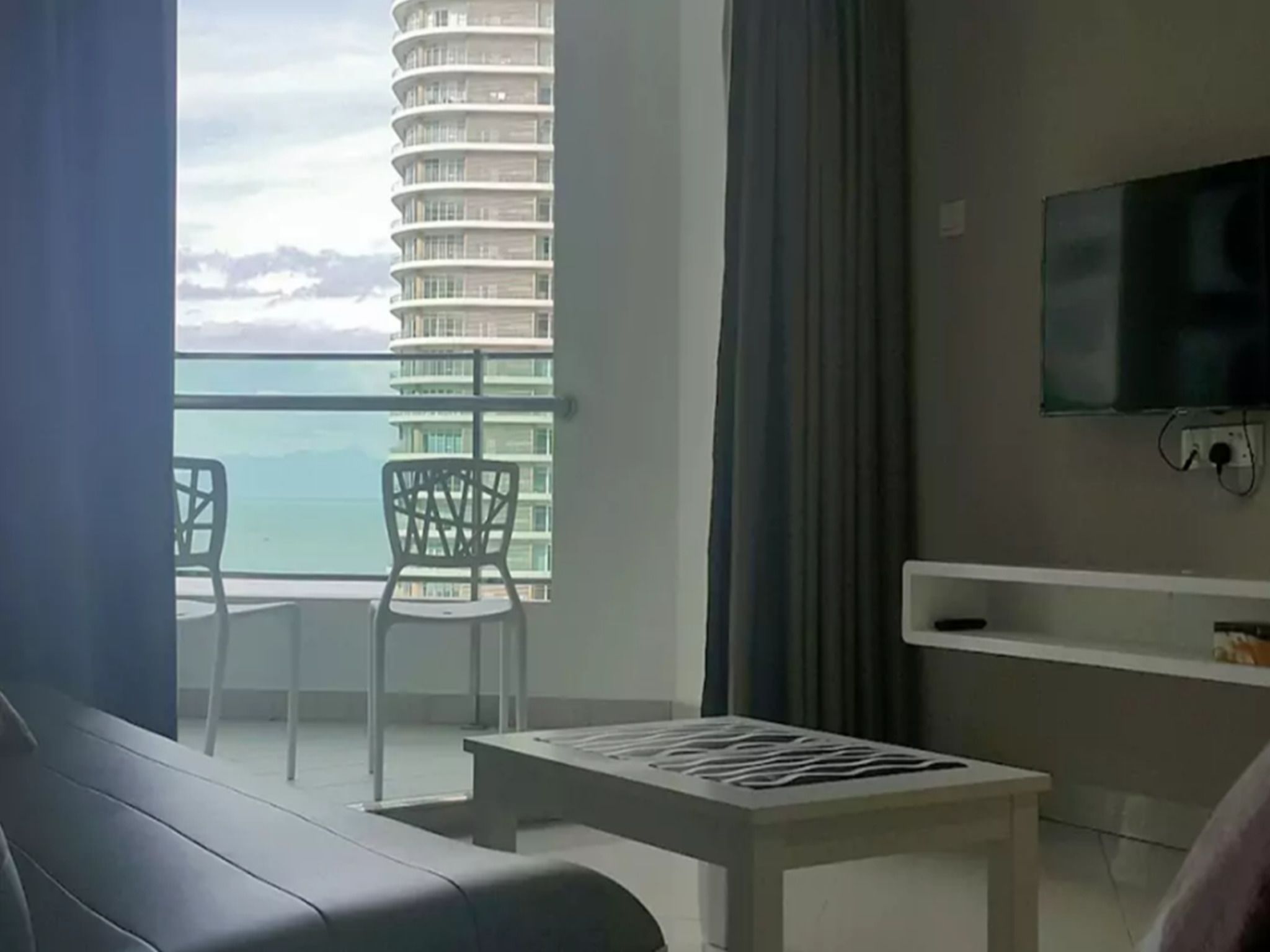 Mansion One Apartment Seaview Type B | Living room | Flat-screen TV