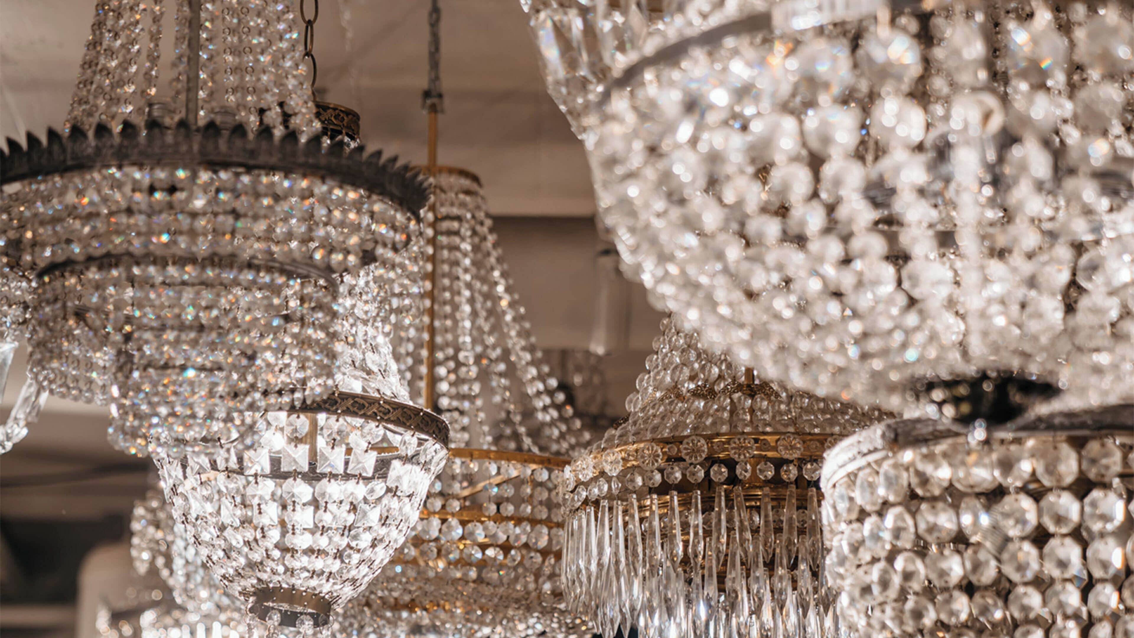 Chandeliers with multiple tiers of crystals.