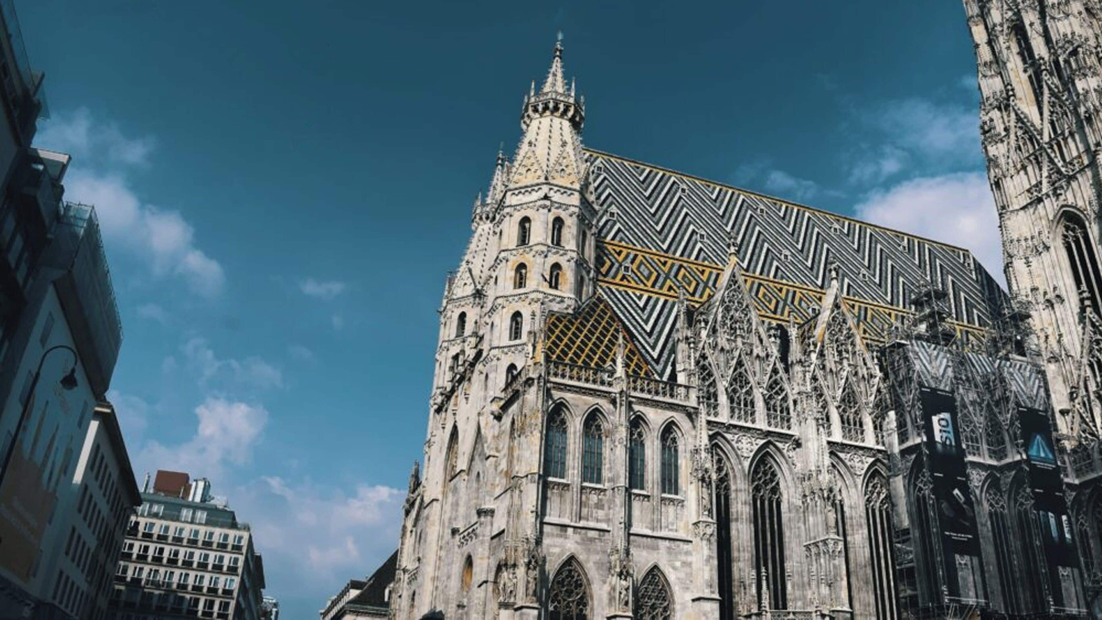 A historic cathedral with intricate Gothic architecture, featuring pointed arches and detailed stonework.