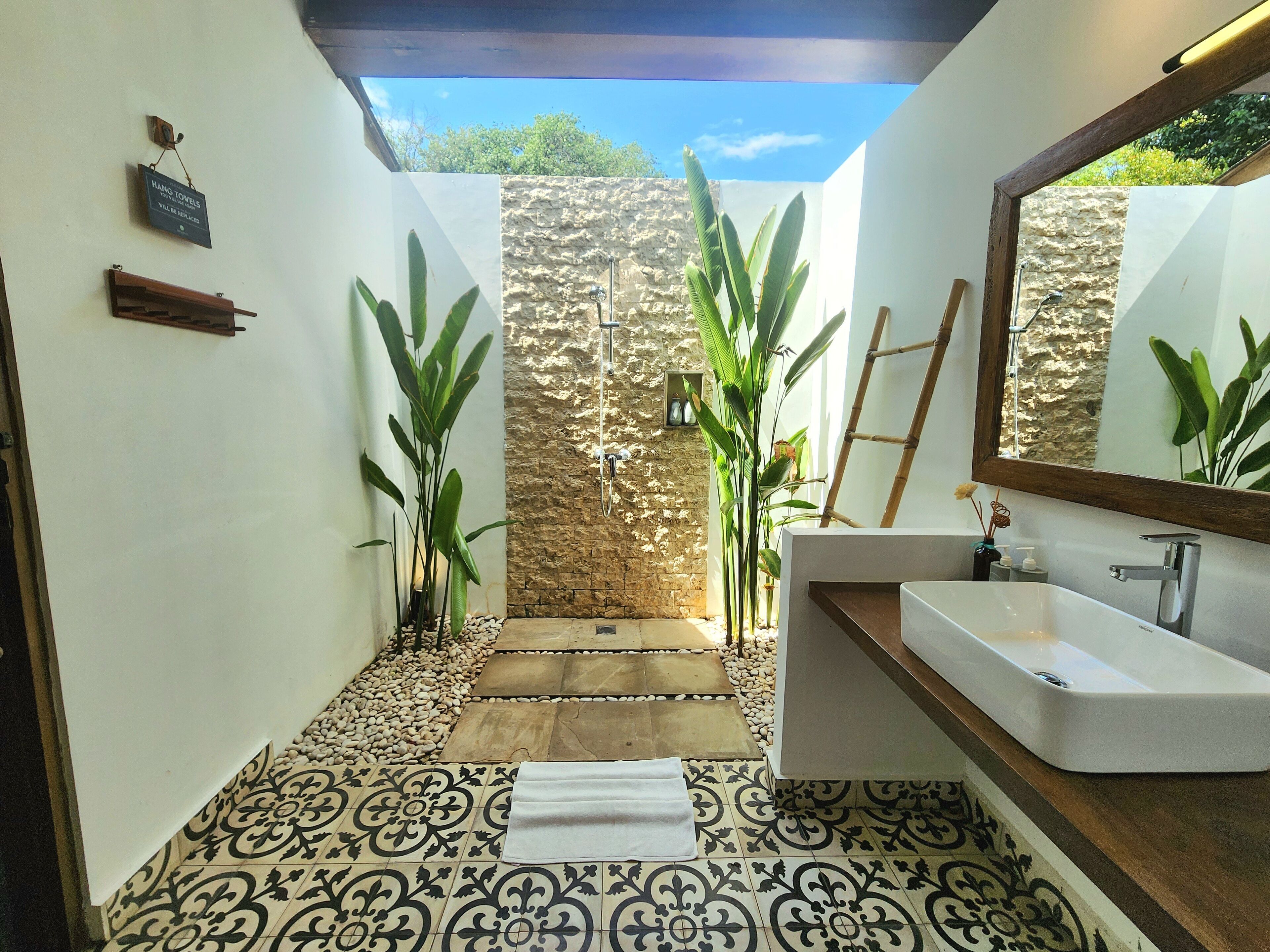 julu suite | bathroom | shower, free toiletries, hair dryer, bathrobes