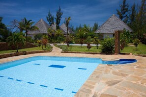 Outdoor pool, sun loungers - Sheba Cottages (Diani Beach)
