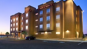 A multi-story hotel with a flat roof, large windows, and a parking lot with handicapped-accessible spaces. - The Hotel at Sunland Park Casino El Paso, an Ascend Collection Hotel (Sunland Park)