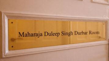 A sign with the text 'Maharaja Duleep Singh Durbar Room' on a yellow background.