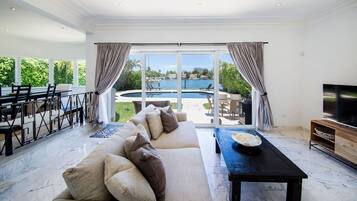 Luxury Villa, 4 Bedrooms, Ocean View | Living area | TV