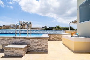 Outdoor pool, open 7:00 AM to 8:00 PM, pool umbrellas, sun loungers