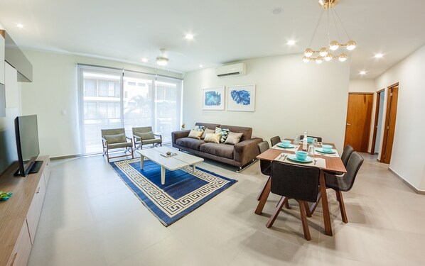 Deluxe Condo, 2 Bedrooms, Accessible, Courtyard Area | Living room | Flat-screen TV