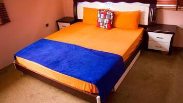 Desk, laptop workspace, bed sheets