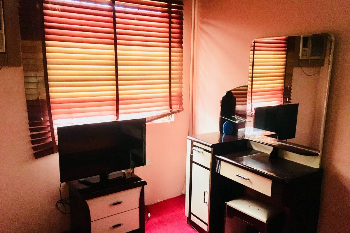 Desk, laptop workspace, bed sheets