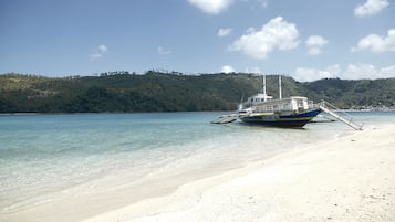 On the beach, beach cabanas, sun loungers, beach umbrellas