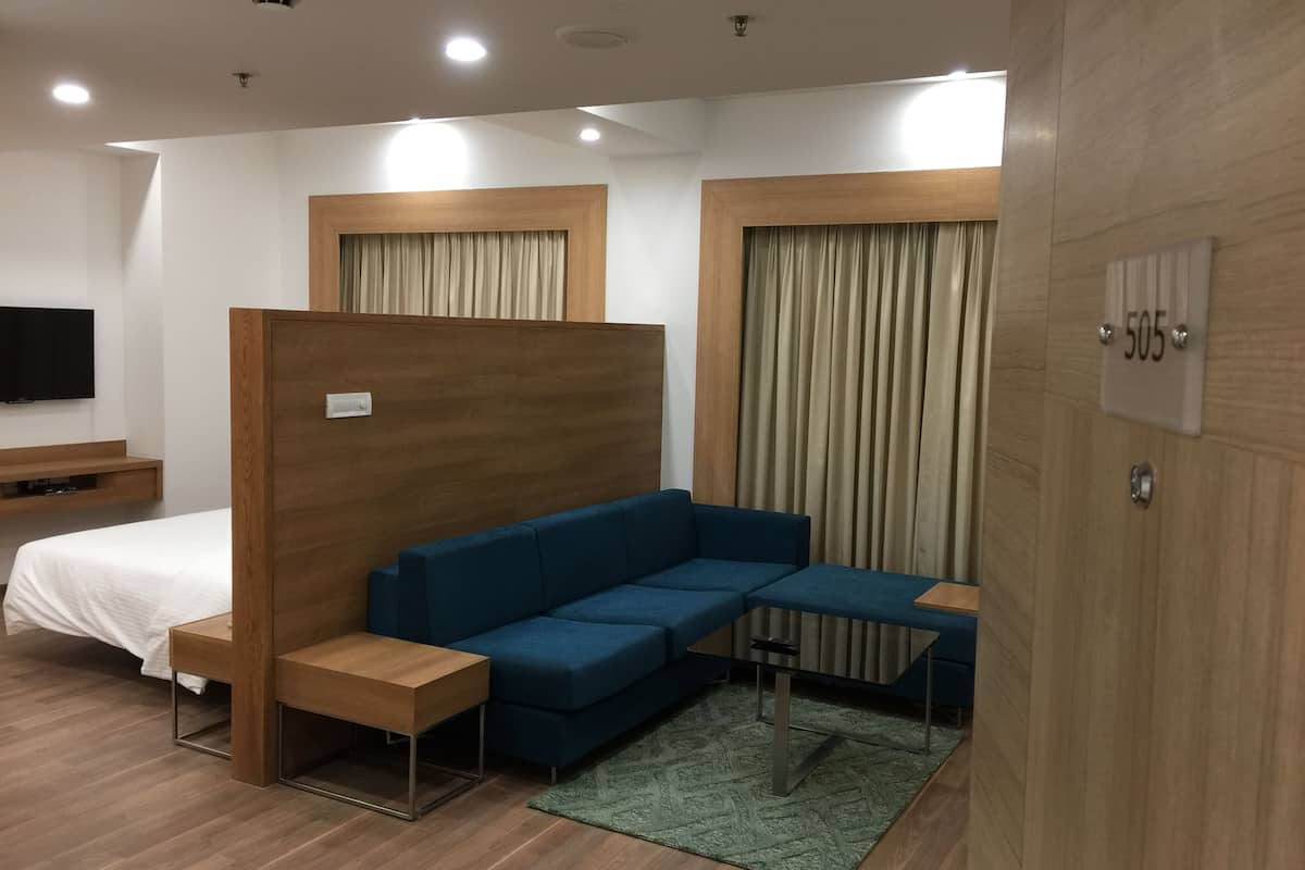 Executive Suite, 1 Bedroom | Living area | LED TV